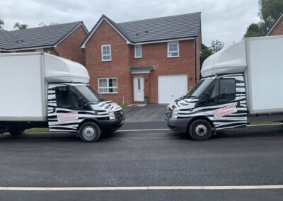 zebra removal vans in front of house