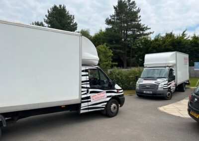 Two vans from Zebra Removals on a local house move